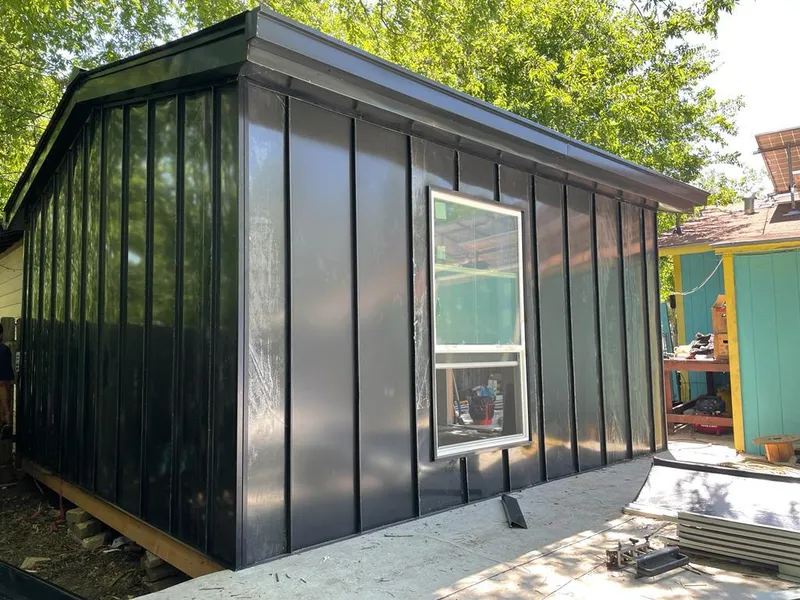 Black standing seam metal wall panels for Roof Inspection in St. Joseph